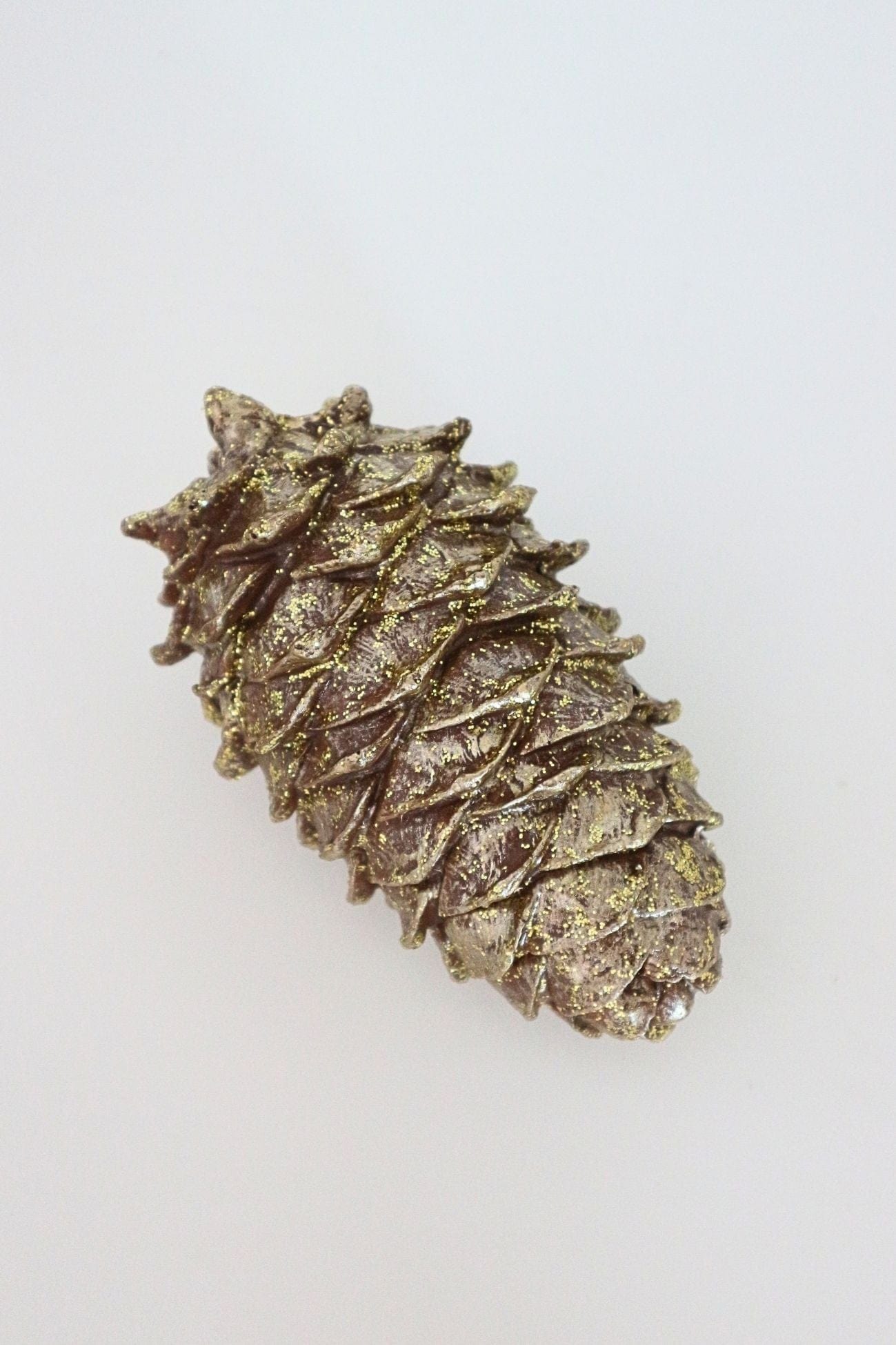 Item International Kotte Kotte - Pigna decorativa natalizia in resina dorata con glitter | Item International